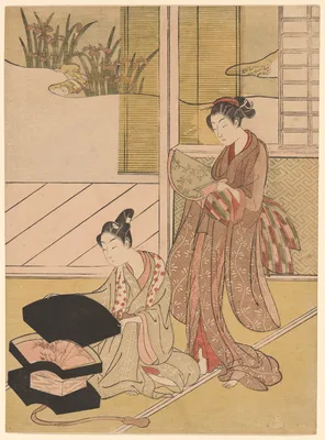 A Fan Peddler Showing his Wares to a Young Woman — Suzuki Harunobu