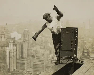 Worker Giving High-Signal to the Derrick Crew — Lewis Hine